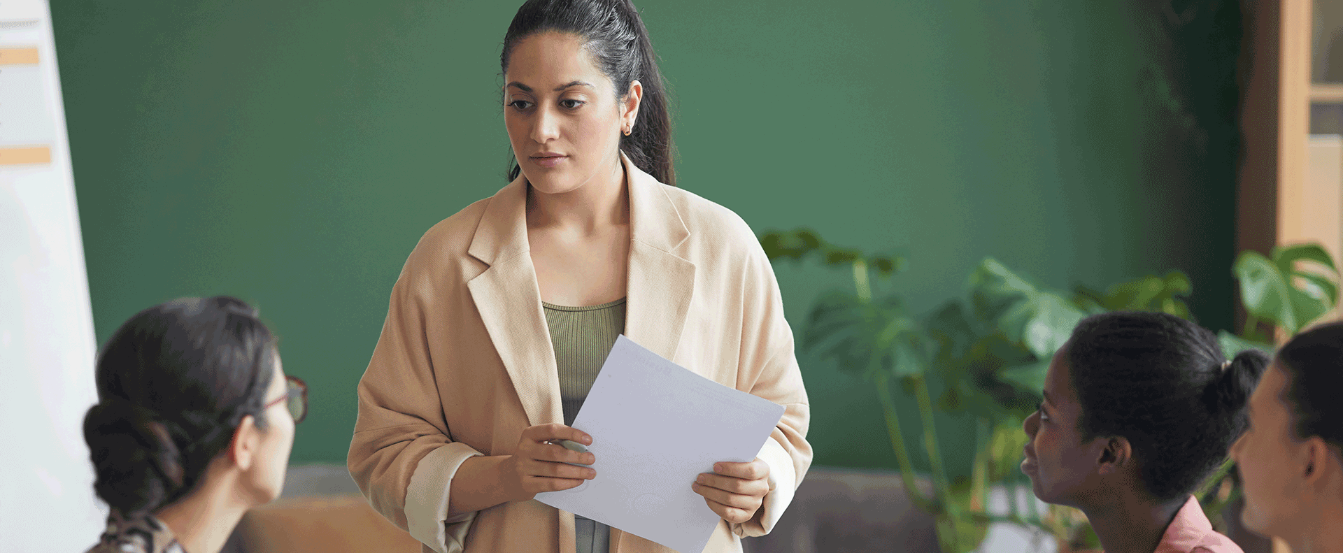A woman teaching and sharing in a group of women engaged in a small group discussion as students in the Master of Arts in Biblical Theology program at Aidan University.
